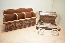 An early 20th century oak desk stand, with hinged stationary compartment, two ink well apertures (