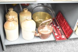 An early 20th century copper tea pot having shaped handle and spout, h24cm, sold together with a