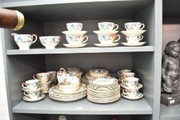 A Royal Cauldon 'Victoria' pattern dinner service, decorated with gilt edge and floral patterns,