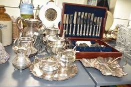 An Arthur Price 44 piece combination canteen, w39cm sold together with a silver plated tea pot ect