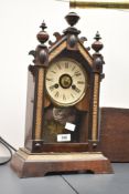 An early 20th century clock having Roman numerals
