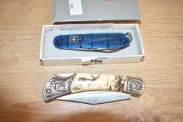 A stainless steel Victorinox Swiss multi-tool, L9cm, sold together with 1 other