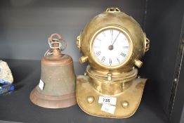A brass divers helmet with quartz clock movement, h21cm, sold together with a metal bell, (2)