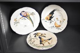 A Gien Grands Oiseaux dinner plate decorated with flying geese, w27cm, sold together with two