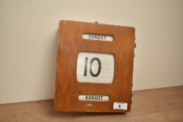 A wooden perpetual desk calendar, h22cm