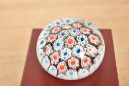 A Murano Millefiori style glass paperweight, w6cm, sold with box.