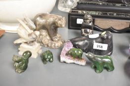 A 20th century soapstone carving of an Inuit, h8.5cm, sold together with a seal and bird ect