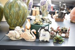 A group of animal trinkets, to include frog, meercat and penguin