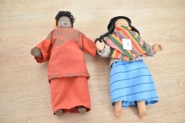A porcelain South American doll in traditional dress, h21.5cm, sold together with similar doll, (2)