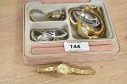 A pale pink velvet jewellery box, containing six wristwatches including Rotary, Sekonda and Lorus