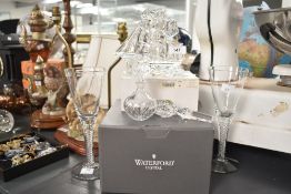 A pair of Waterford crystal champagne glasses having twist stem and fluted basin, h22cm, sold