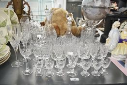 A quantity of cut crystal glasses, to include champagne glasses, tumblers and decanters ect