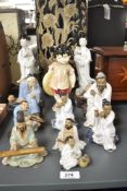 A selection of Chinese 'Mudmen' figures, sold together with two 20th century figures of Guanyin, and