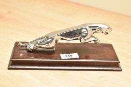 A 20th century Jaguar car mascot mounted on a wooden base, L20cm