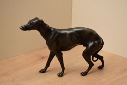 A small cast patinated spelter greyhound study, nicely modelled, measuring 15cm tall.