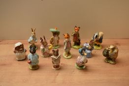 A group of twelve Beswick Pottery and Royal Albert Beatrix Potter characters to include '