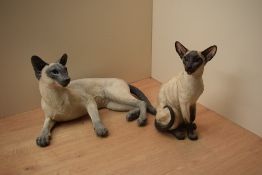 A Border Fine Arts Siamese cat 'Seal Point' model number B0369A, sold together with a similar larger