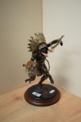 A Franklin Mint 'Spirit of the Thunderbird' cold painted patenated metal statue, modelled as a