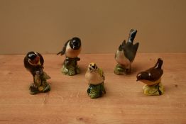 A group of five Beswick Pottery bird studies including 'Stonechat' model number 2274, 'Goldfinch'