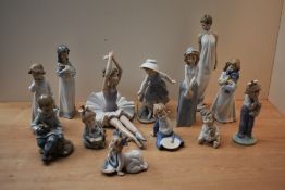 A large group of thirteen Nao by Lladro porcelain figures and figurines too include 'Girl with dog',