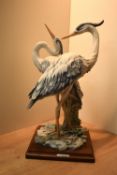A Capodimonte porcelain animal group by Giuseppe Armani depicting two herons, signature to front