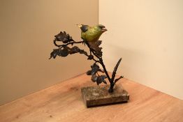 An Albany Fine China Greenfinch bird study on bronze oak branch with marble and wood pedestal base