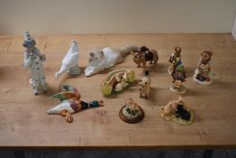 A miscellaneous selection of figures and animal studies to include a Nao by Lladro porcelain Cat and