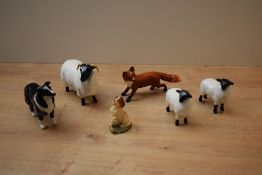 A Beswick Pottery Black-Faced Sheep model number 1765 designed by Mr Garbet in black and white gloss