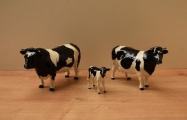 A Beswick Pottery Friesian Cow and Bull trio comprising Friesian Bull CH. 'Coddington Hilt Bar'