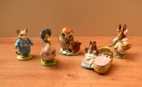 A group of five Beswick Pottery Beatrix Potter characters including 'Tom Kitten' crack to base, '