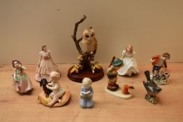 Two Royal Doulton bone china figurines 'Babie' HN 1679 and 'Lynsey' HN 3043 sold alongside a Beswick