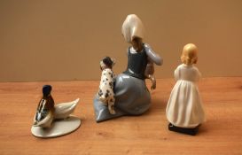 A Royal Doulton bone china figurine 'Bedtime' HN 1978 sold together with a Lladro porcelain group '