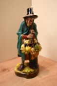 A Royal Doulton bone china figurine 'The Mask Seller' HN 2103.