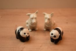 A pair of Beswick Pottery Panda Cubs model number 1815 designed by Albert Hallam in black and