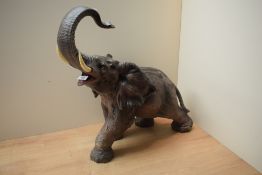 A large ceramic painted elephant study, measuring 46cm x 46cm approximately.