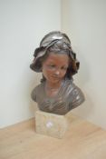 A large resin bust on square single step marble base of a female, measures 40cm tall.