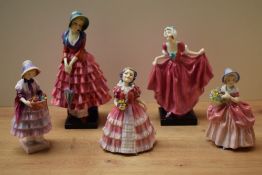 A group of five Royal Doulton bone china figurines comprising 'Ruby' HN 1724, 'Greta' HN 1485, '