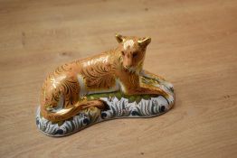 A Royal Crown Derby paperweight 'Lioness' having Imari style decoration and gold coloured stopper,