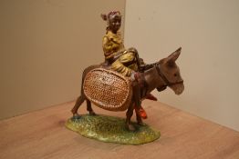 A Beswick Pottery 'Suzie Jamaica' figure, model number 1347 in brown yellow and green gloss