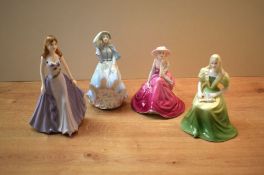 A group of four Coalport bone china figurines comprising 'Fascination', Debutantes 'Emily', '