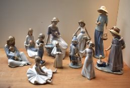 A group of eleven Lladro and Nao by Lladro porcelain figures/figurines to include 'Girl with Toy