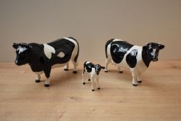 A Beswick Pottery Friesian Cow and Bull trio comprising Friesian Bull CH. 'Coddington Hilt Bar'