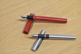 Two Sheaffer cartridge fill fountain pens. A No Nonsense in Red and a Brushed steel
