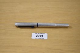 A Parker 25 MkII rollerball pen in stainless steel flighter with blue insets
