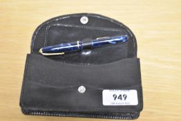 A Conway Stewart Dinkie 550 lever fill fountain pen in Blue Marble with a single cap band having