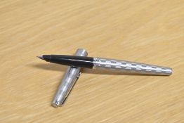 A boxed Parker 45 Harlequin cartridge fill fountain pen in the shield pattern