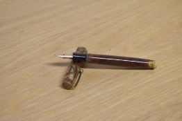 A Parker Moderne button fill fountain pen in Brown with single narrow band to the cap having