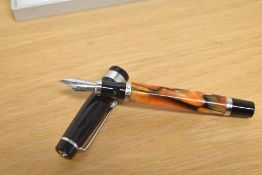 A boxed Kingsley converter fill fountain pen in Atlantic Coral with broad Greek keys decorated