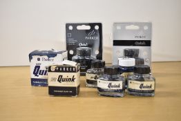 Eight Parker Quink ink bottles. Four 1 fl oz (one boxed), a boxed Super Quink ink, a boxed 2fl oz