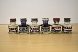 Six Carr's ink bottles